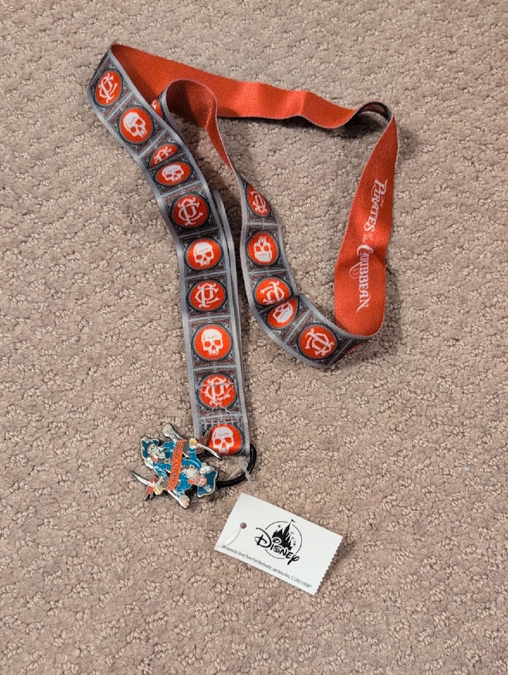 Disney Pirates of the Caribbean Orange and Gray Skull Lanyard with Enamel Charm